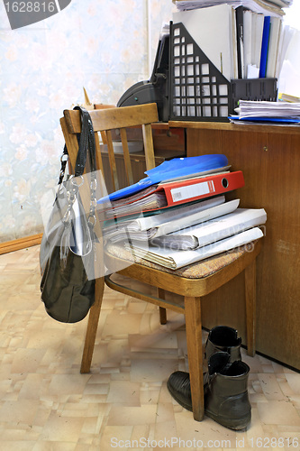 Image of files on chair in office