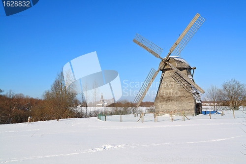 Image of aging mill on snow field