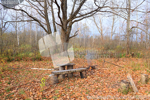 Image of aging bench in autumn park