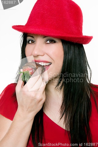 Image of Girl eating strawberries