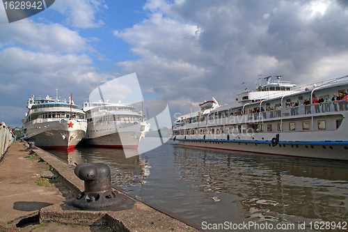 Image of three motor ships on quay