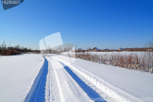 Image of snow road near winter of the villages