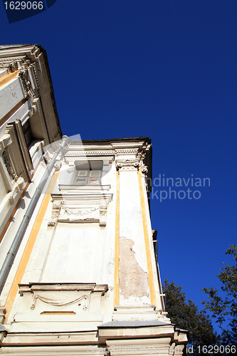 Image of ancient brick building on blue background