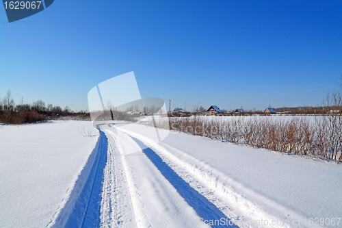Image of snow road near winter of the villages