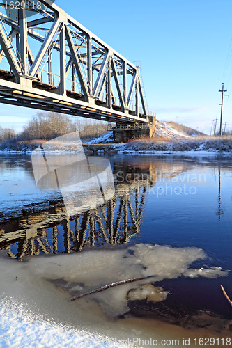 Image of railway bridge through small river