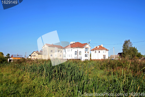 Image of new cottages near green marsh