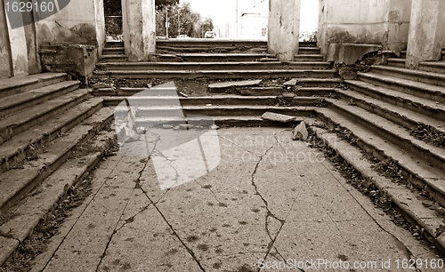 Image of aging stairway in destroyed building, sepia 