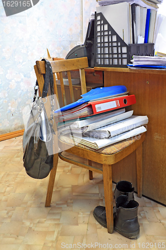 Image of files on chair in office