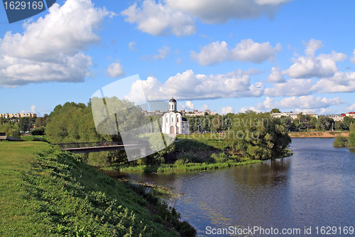 Image of christian church on river coast