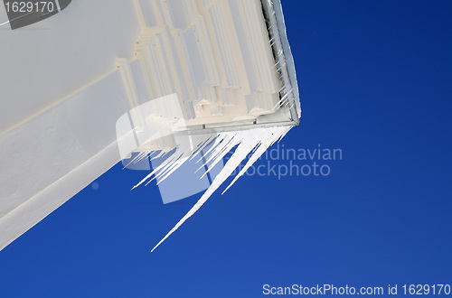 Image of white icicles on roof of the building