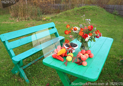 Image of autumn still life on garden table