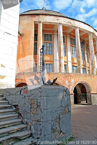 Image of anchor near old building 