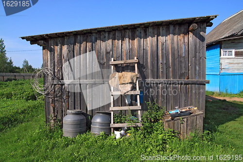 Image of rural shed on green herb