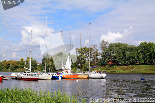 Image of small sailboats on small river