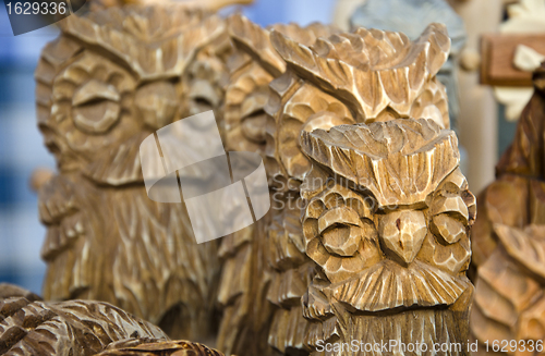 Image of Owl figurines carved of wood. Handmade wares. 
