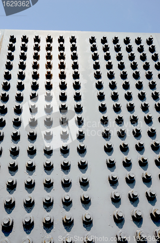 Image of Modern wall with screws, nuts and bolts background