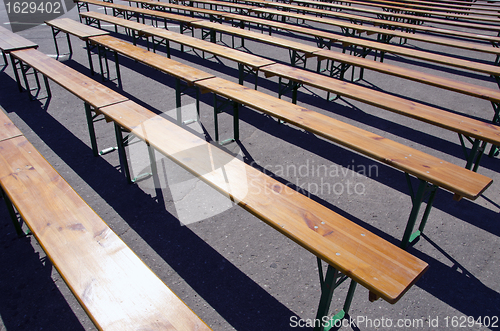 Image of Wooden benches placed in square for meeting. 