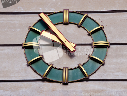 Image of Modernistic clock on wall of industrial building. Time passing. 