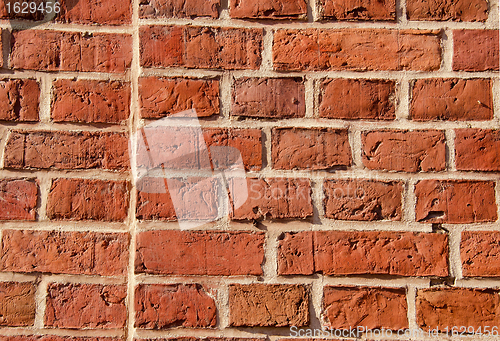 Image of Old brick wall built of clay bricks. 