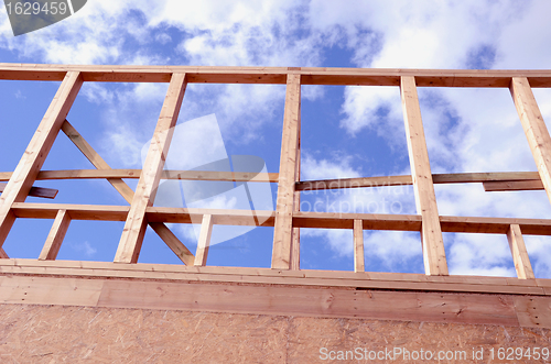 Image of Newly constructed wooden frame house fragment. 
