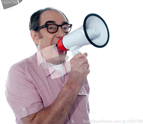 Image of Senior casual male with megaphone