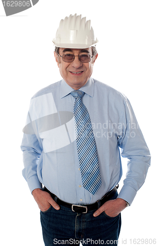 Image of Successful aged builder posing in style