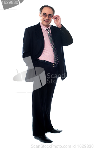 Image of Old businessperson posing in style