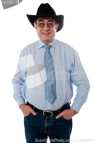 Image of Portrait of a senior cowboy wearing hat