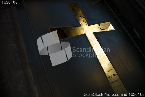 Image of Cross in door at tomb cemetery