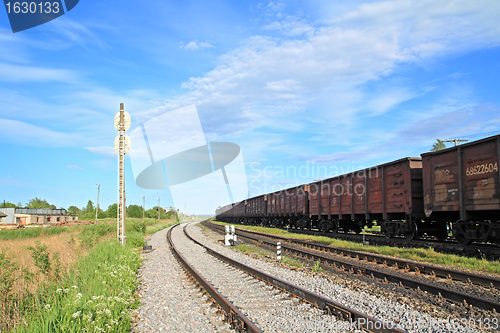 Image of train on small railway station 