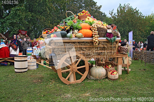 Image of fruits and vegetables in cart on rural market