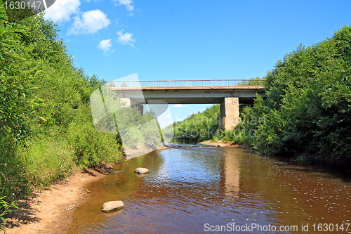 Image of old car bridge through small river