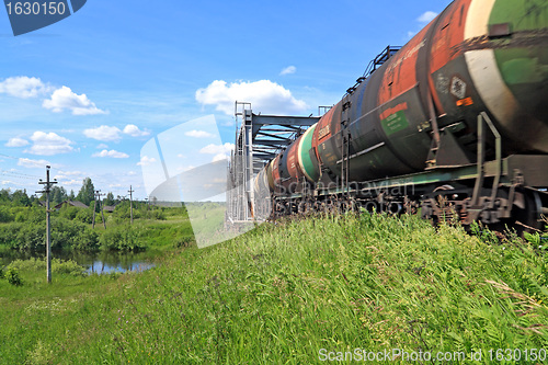 Image of freight train near railway bridge