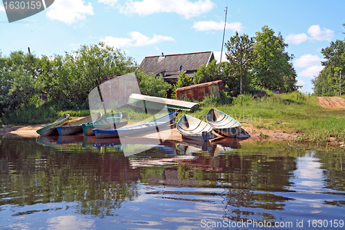 Image of rural boats on coast river