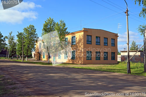 Image of yellow building on rural street