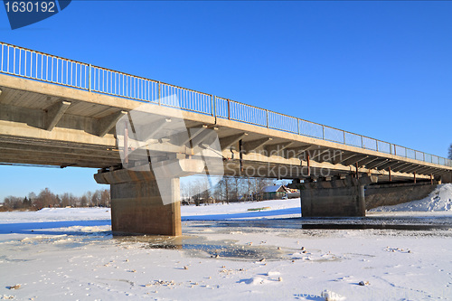 Image of car bridge through small river