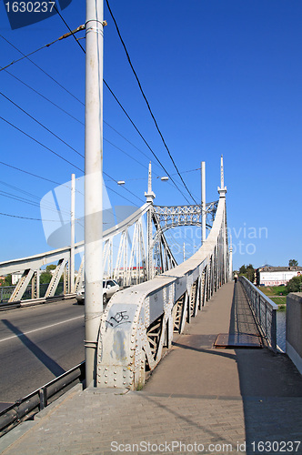 Image of town bridge through small river