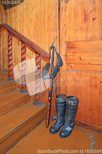 Image of hunting handgun in the corner hunting house