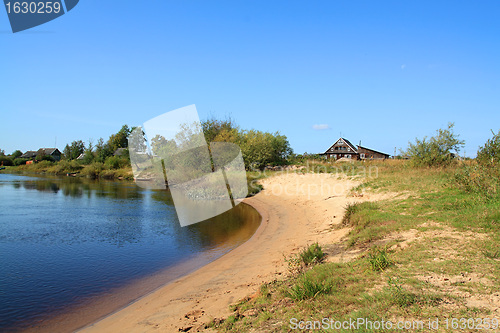 Image of old house on coast river