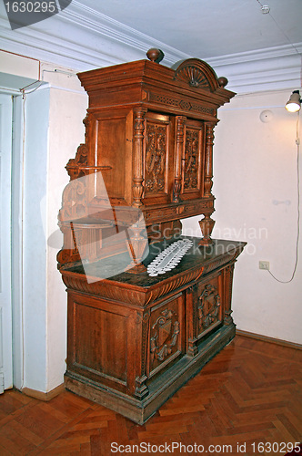 Image of old dresser on parquet floor