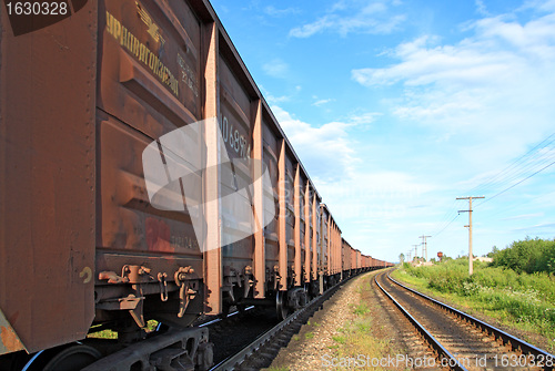 Image of train on small railway station 