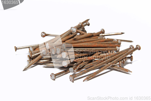 Image of rusty nail on white background