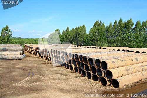 Image of old gas pipes on dirty road