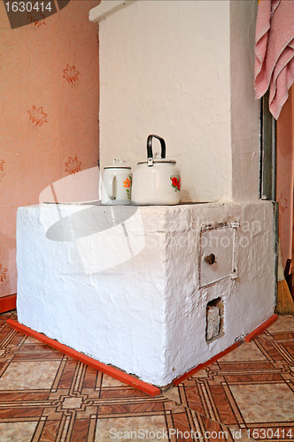 Image of brick stove in rural wooden house