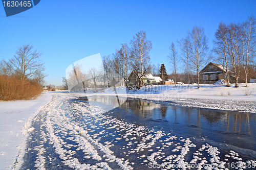 Image of winter village on coast river 