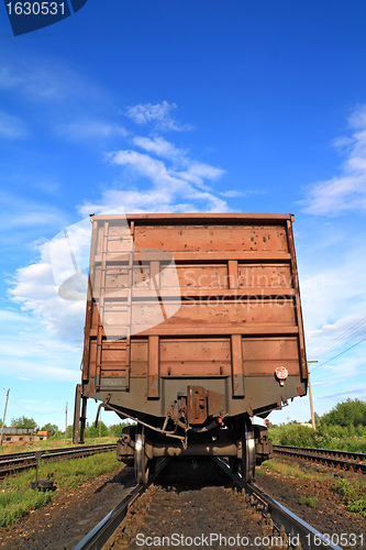 Image of railway freiht-car on rural station 