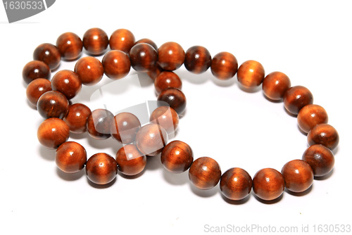 Image of wooden necklace on white background