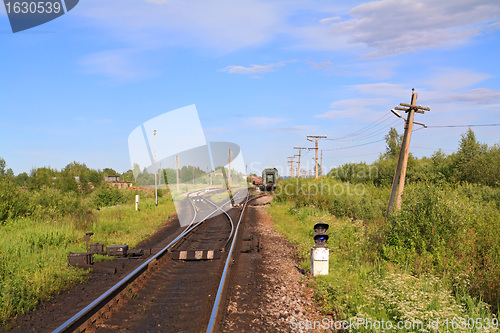 Image of train on small railway station 