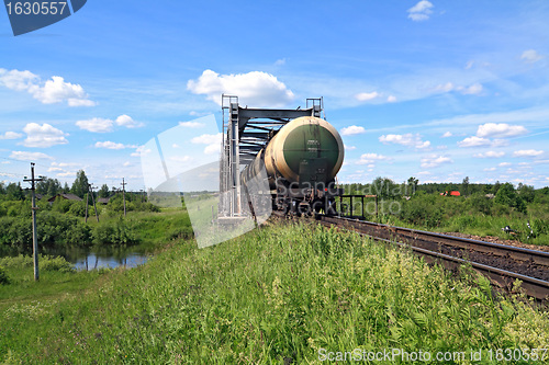 Image of freight train near railway bridge