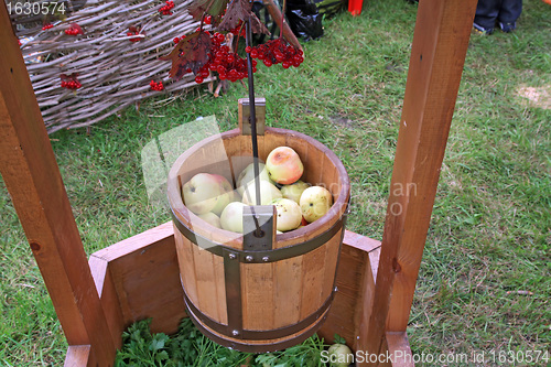 Image of apple in pail on rural market